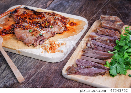 T-bone steak with sliced beef T-bone steak with sliced beef 47345762