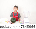 Little boys blend water melone juice by using blender at home 47345966