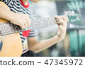 Asian girl studyguitar in the music classroom 47345972
