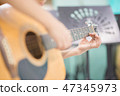 Asian girl studyguitar in the music classroom 47345973
