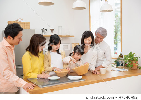 Three generations family parent and child kitchen dish image 47346462