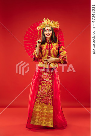 Chinese traditional woman. Beautiful young girl wearing in national costume 47348031