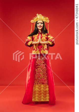 Chinese traditional woman. Beautiful young girl wearing in national costume 47348041