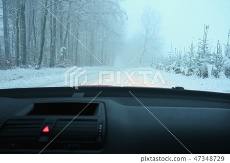 Driving the car in the winter. Interior. Driving the car in the winter. Interior. 47348729