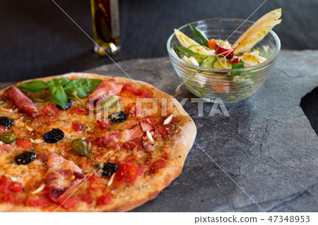 Pizza and salad 47348953