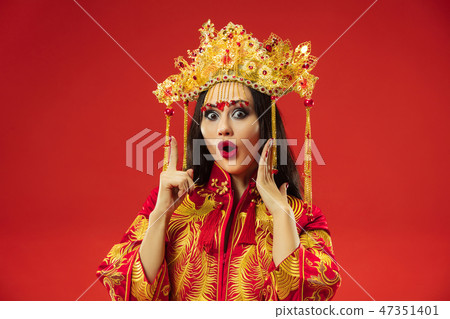Chinese traditional woman. Beautiful young girl wearing in national costume 47351401