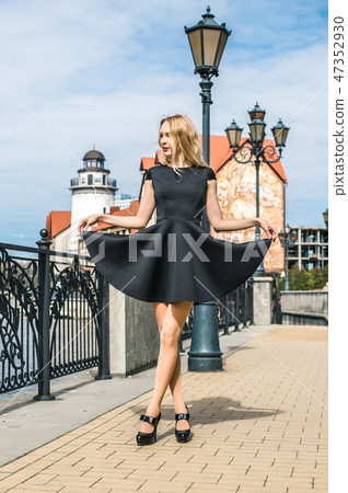 Beautiful girl walking in the street of city Beautiful girl walking in the street of city 47352930