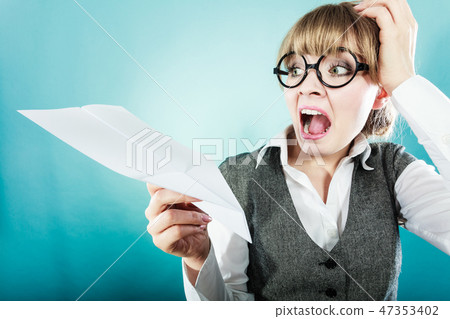 Fly fear. Woman holding airplane in hand. 47353402
