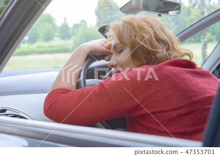 Woman is resting in the car 47353701