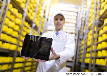 Worker shows an empty screen digitizer in stock cheese 47353876
