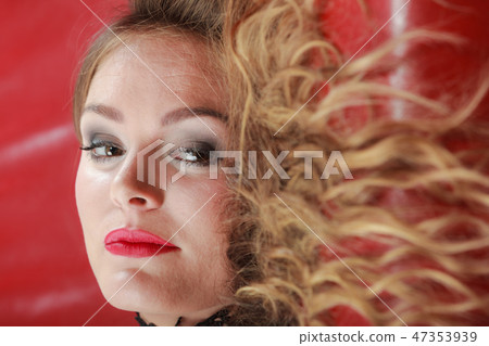 Woman lying on sofa, blond hair Woman lying on sofa, blond hair 47353939