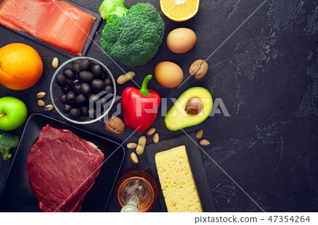 Image of products for diet on black stone table . Place for inscription on side of photo. Image of products for diet on black stone table . Place for inscription on side of photo. 47354264