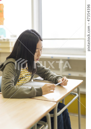 Child studying elementary school image Child studying elementary school image 47354396