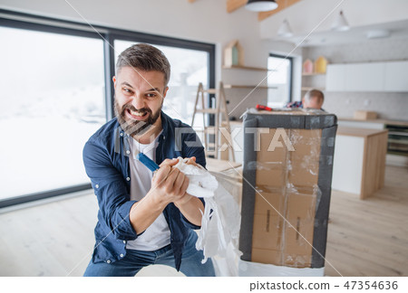 A mature man with his senior father furnishing new house, a new home concept. 47354636