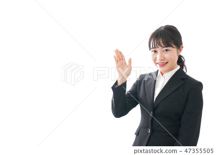 A young woman with a finger in her suit A young woman with a finger in her suit 47355505