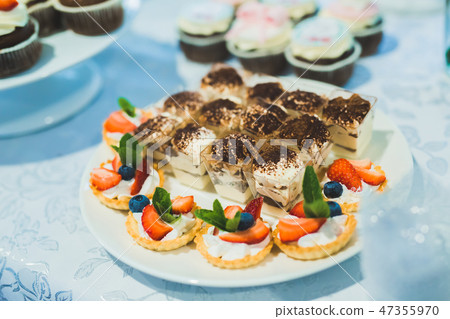 Delicious sweets on wedding candy buffet with desserts, cupcakes 47355970