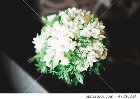Beautiful wedding bouquet with different flowers, roses 47356314
