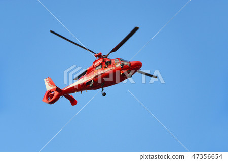 A firefighting and disaster prevention helicopter performing a demonstration flight at the New Year's parade A firefighting and disaster prevention helicopter performing a demonstration flight at the New Year's parade 47356654