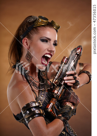 Portrait of a beautiful steampunk woman over smoke background. 47356815