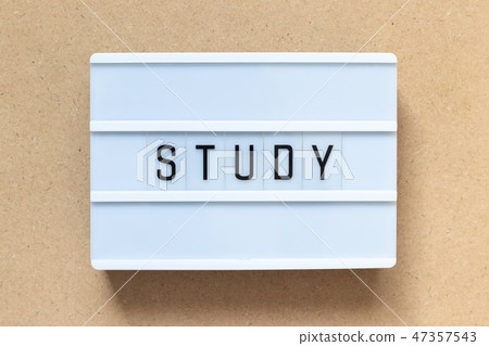 White lightbox with word study on wood background White lightbox with word study on wood background 47357543