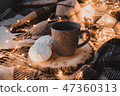 A cup of black tea with white marshmallow. 47360313