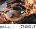 A cup of black tea with white marshmallow. 47360315