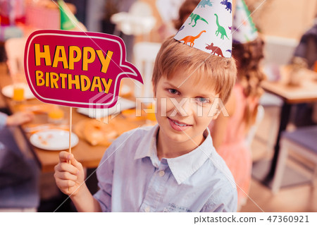 Portrait of cheerful kid that holding namecard Portrait of cheerful kid that holding namecard 47360921