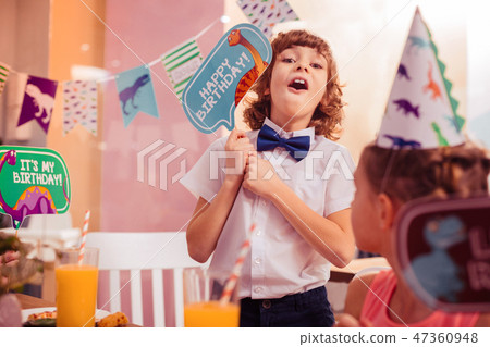 Emotional brunette boy looking straight at camera Emotional brunette boy looking straight at camera 47360948