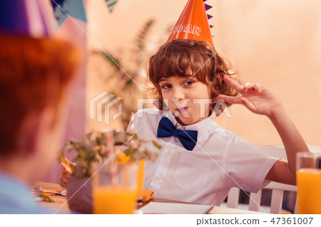 Positive delighted brunette teenager posing on camera Positive delighted brunette teenager posing on camera 47361007