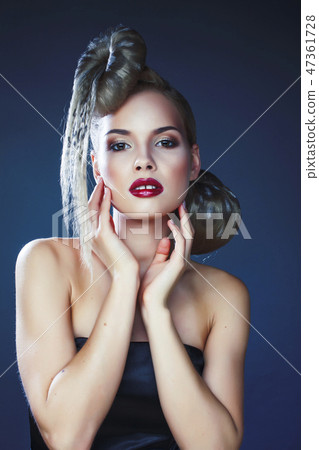 young elegant woman with creative hair style leopard print close up on dark blue background, fashion young elegant woman with creative hair style leopard print close up on dark blue background, fashion 47361728