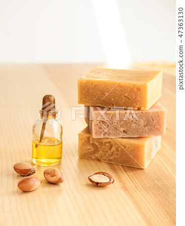 Bottle with cosmetic oil argan nuts. Cosmetic means. Food product. Jar with argan oil and handmade 47363130