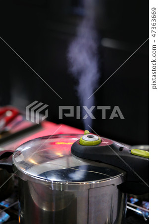Pressure cooker steam over cooking in a Kitchen 47363669