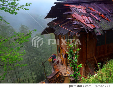 Peasant House with a wet roof, on brink Peasant House with a wet roof, on brink 47364775