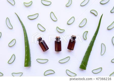Aloe vera with essential oil bottles on white 47366216