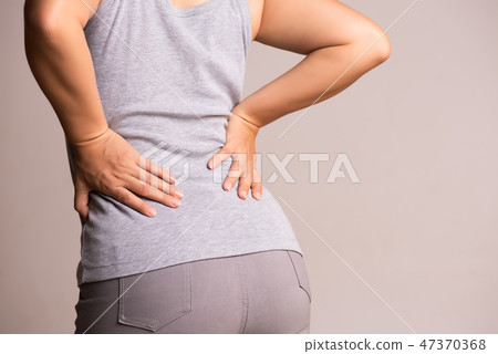 Close up woman having pain in injured back. Close up woman having pain in injured back. 47370368