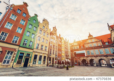 Old tenement houses and a gate. 47370836