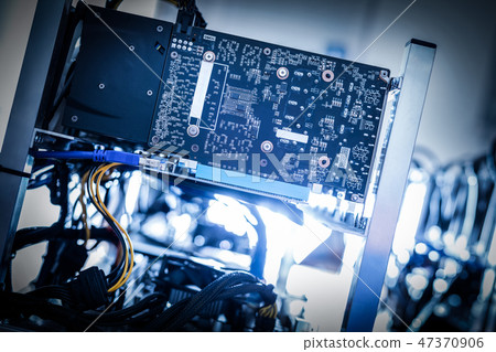 Fragment of cryptocurrency miner in a close-up shot. Fragment of cryptocurrency miner in a close-up shot. 47370906