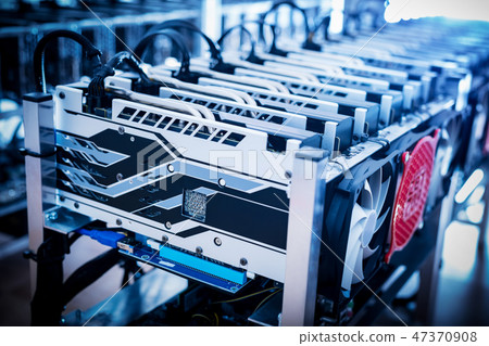 Bitcoin mining devices standing in a row. Bitcoin mining devices standing in a row. 47370908