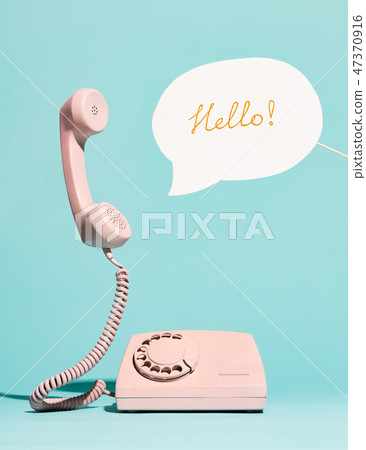 Pink vintage phone and speech bubble saying HELLO Pink vintage phone and speech bubble saying HELLO 47370916