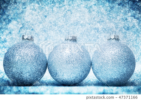 Christmas glass balls on cold frosty glitter background Christmas glass balls on cold frosty glitter background 47371166