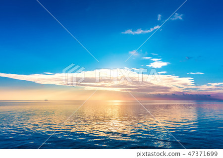 Calm ocean at sunset. Dramatic sky 47371699