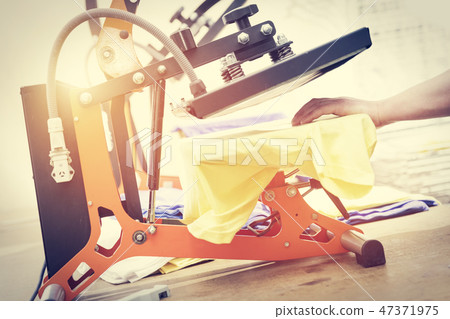 Preparing t-shirt for printing in the silk screen printing machine 47371975