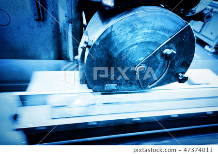 Big metal saw at work in workshop. Industrial Big metal saw at work in workshop. Industrial 47374011