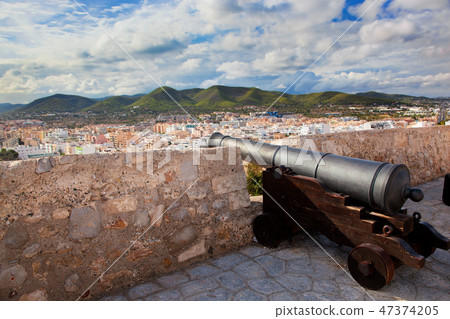 Cannon and panorama of Ibiza, Spain Cannon and panorama of Ibiza, Spain 47374205