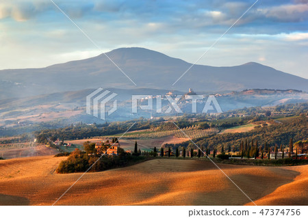 Tuscany landscape at sunrise. Tuscan farm house, cypress trees, hills. Tuscany landscape at sunrise. Tuscan farm house, cypress trees, hills. 47374756