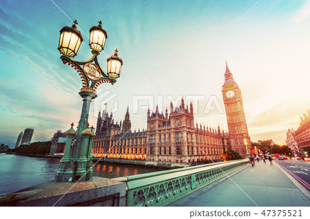 Big Ben, London the UK at sunset. Retro street lamp light on Westminster Bridge. Vintage 47375521