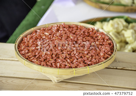 Seed corn in bamboo baskets on wooden table. Seed corn in bamboo baskets on wooden table. 47379752