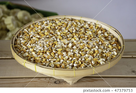 Seed corn in bamboo baskets on wooden table. Seed corn in bamboo baskets on wooden table. 47379753