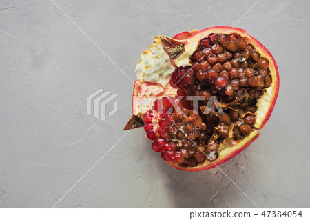 Rotten grains of pomegranate in the overripe fruit Rotten grains of pomegranate in the overripe fruit 47384054