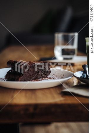 Slice of vegan chocolate brownie cake Slice of vegan chocolate brownie cake 47384404
